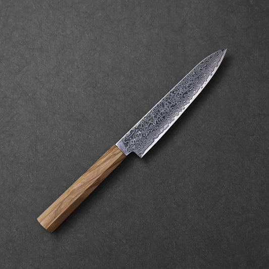SG2 damascus petty knife with olive wood handle; photographed to showcase the detailed blade pattern, compact profile, and warm, natural grain of the olive wood handle.