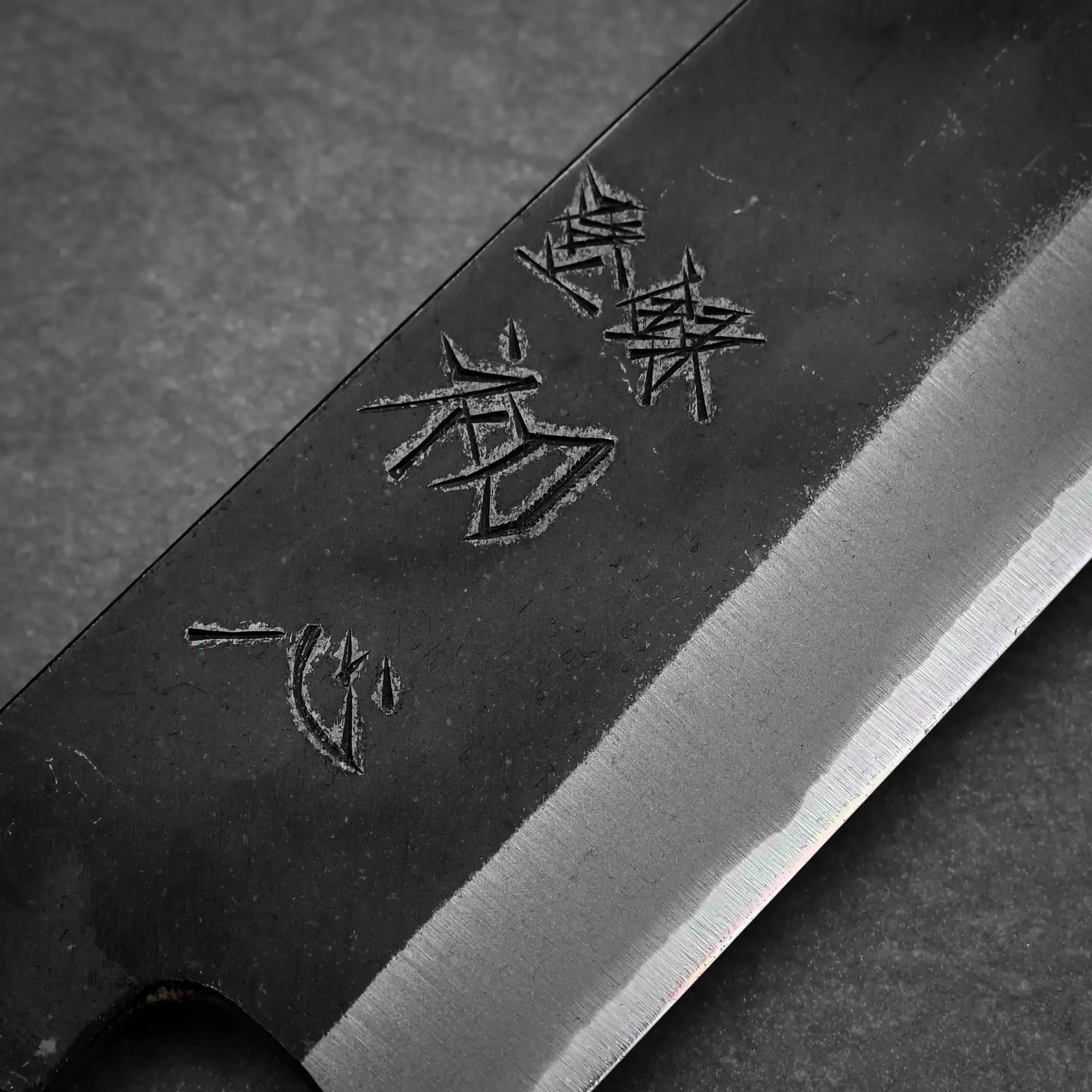 Close up view of Hatsukokoro Aosagi kurouchi aogami#2 gyuto knife 210mm showing kanji