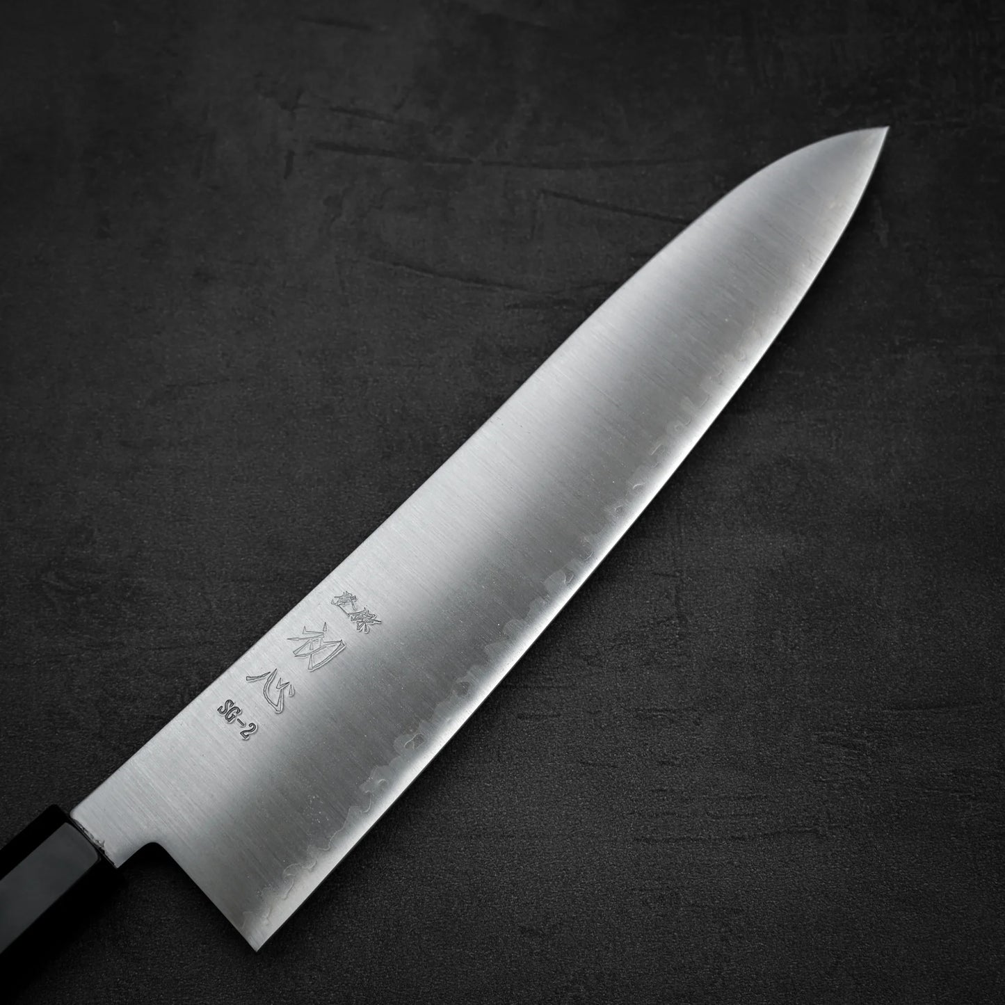 Close up view of the front side of Hatsukokoro Hayabusa SG2 gyuto knife