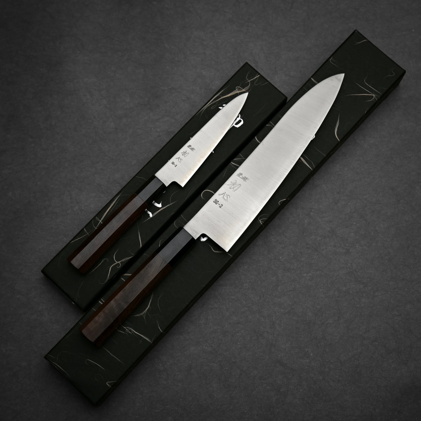 Hatsukokoro Hayabusa SG2 gyuto and petty knife set showing full blade profile with box