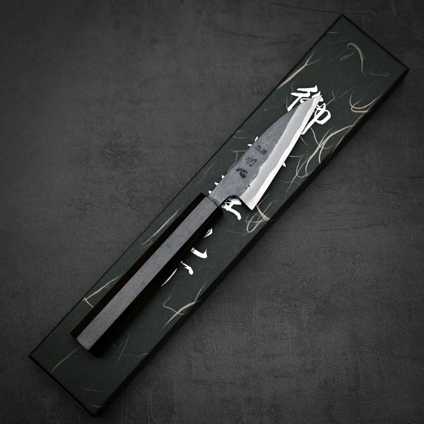 Top down view of Hatsukokoro kurouchi aogami#2 petty knife with its box