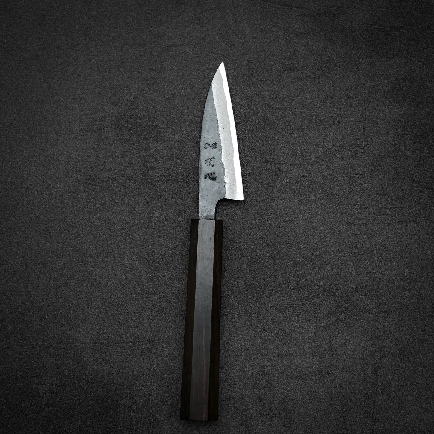 Top down view of Hatsukokoro kurouchi aogami#2 petty knife in vertical position