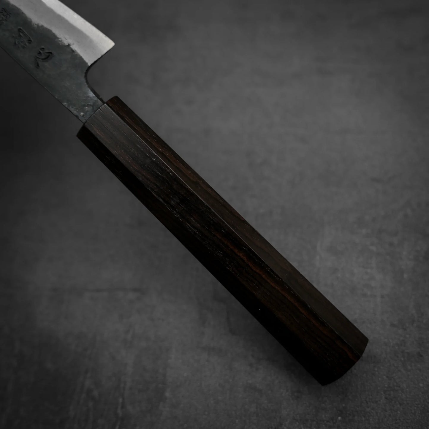 Close up view of the handle of Hatsukokoro kurouchi aogami#2 petty knife