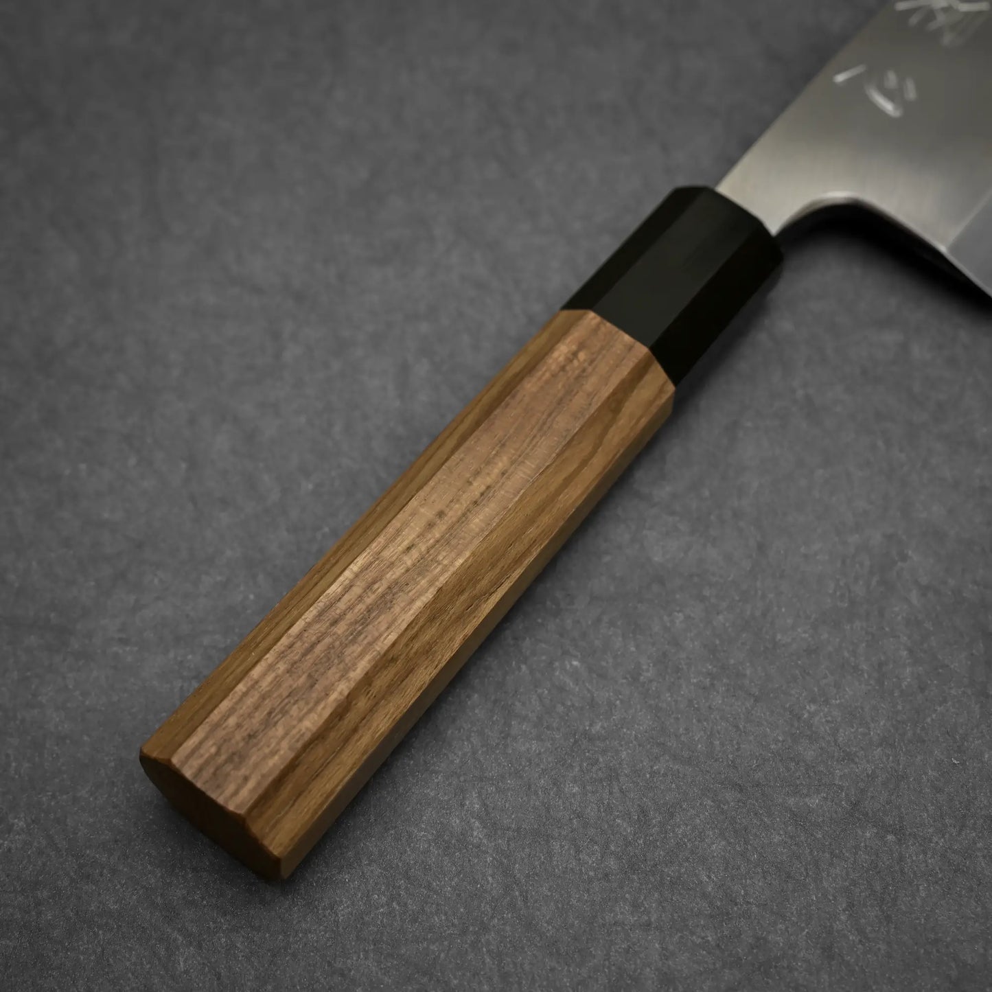 Close-up shot of the handle of 180mm Hatsukokoro Shirasagi ginsan deba knife