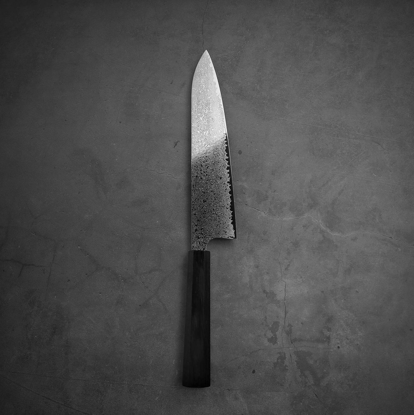 Top view of Hatsukokoro ginsan damascus gyuto 240mm in vertical position