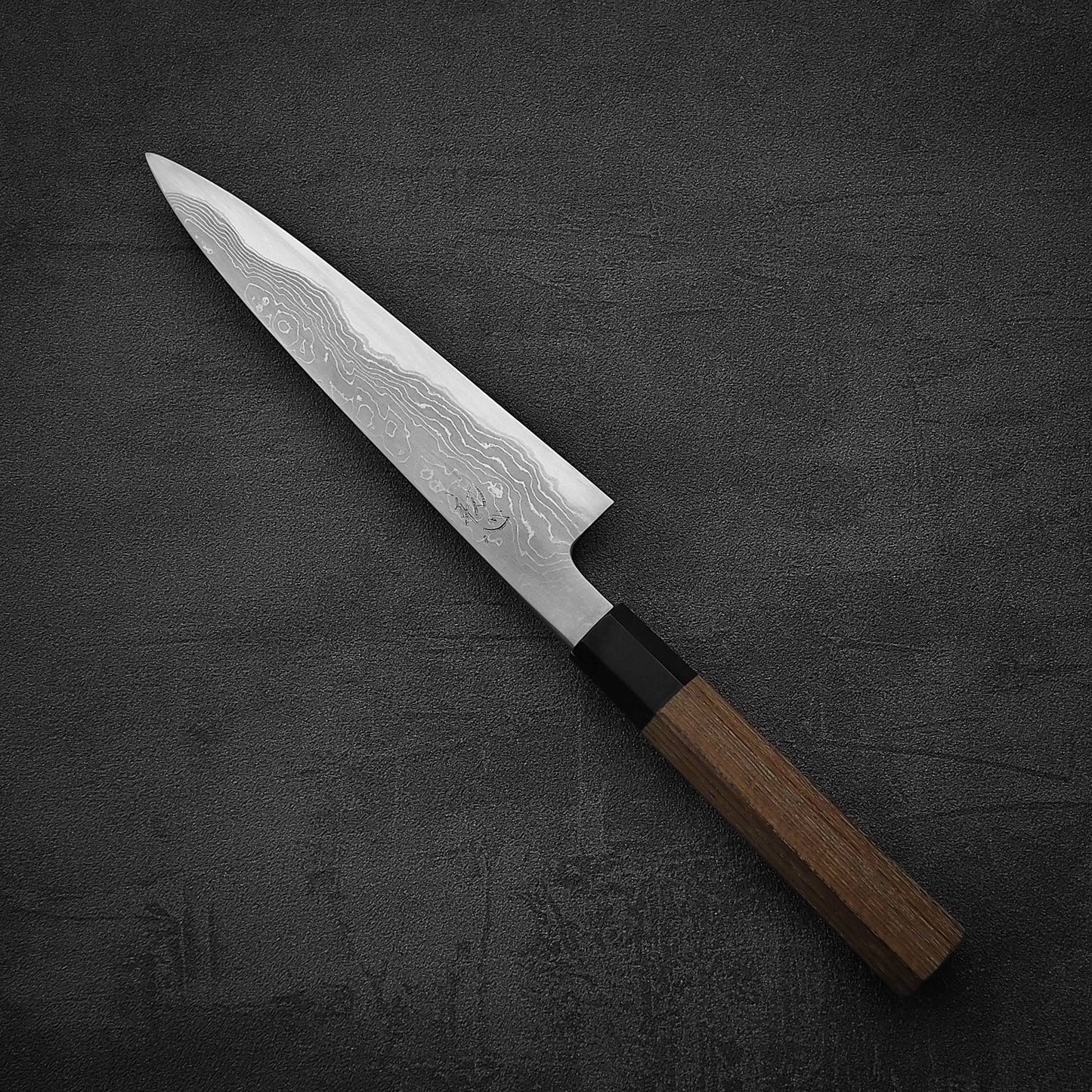 Angled view of Hatsukokoro Komorebi damascus aogami#1 petty knife