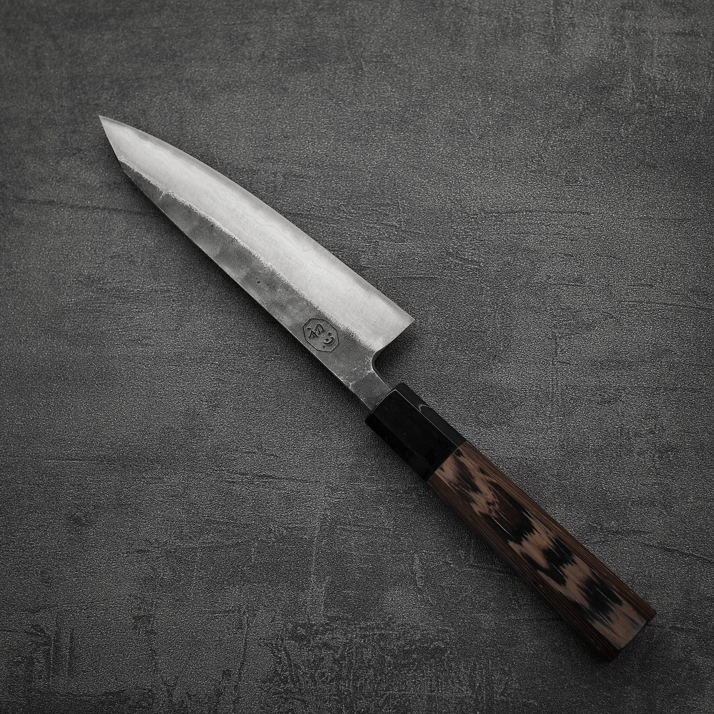 Top down view of Hatsukokoro Kumokage kurouchi damascus aogami#2 honesuki knife