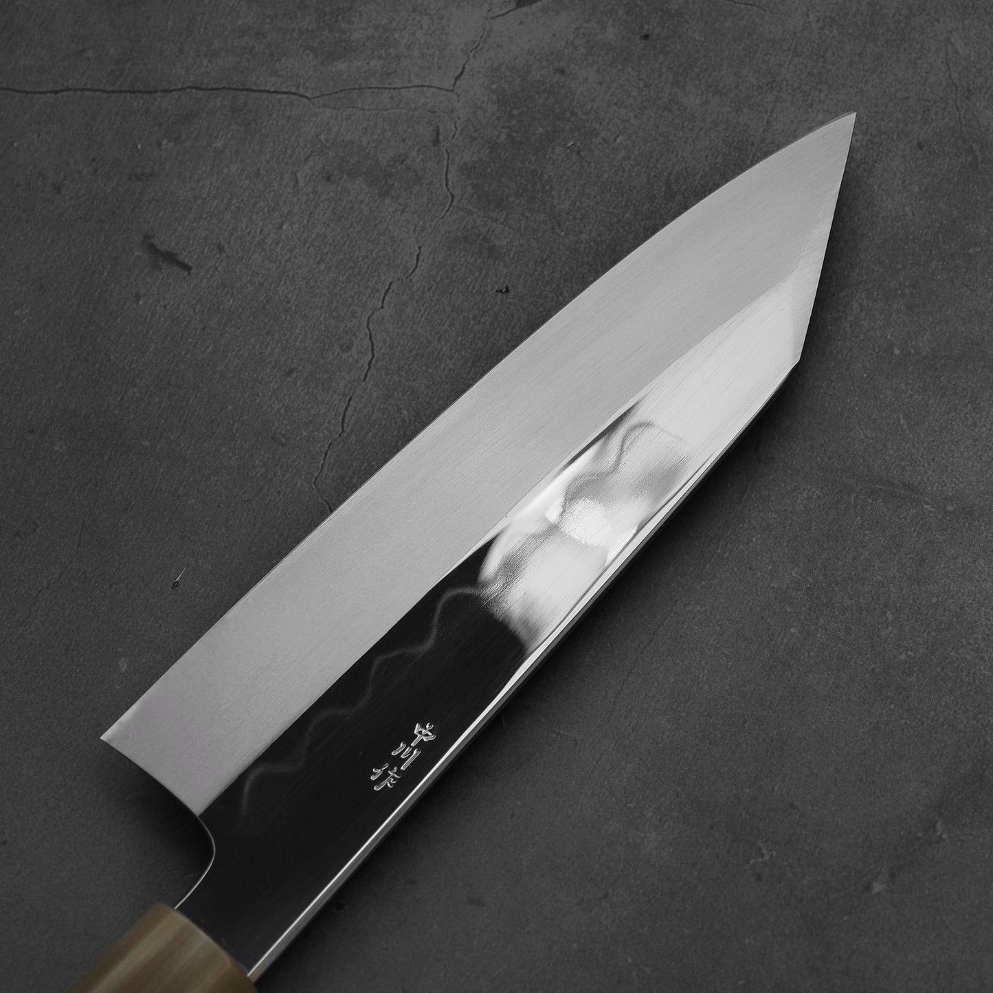 Close up view of the back side of Nakagawa shirogami#3 honyaki bunka. This Japanese knife is sharpened by Morihiro hamono.