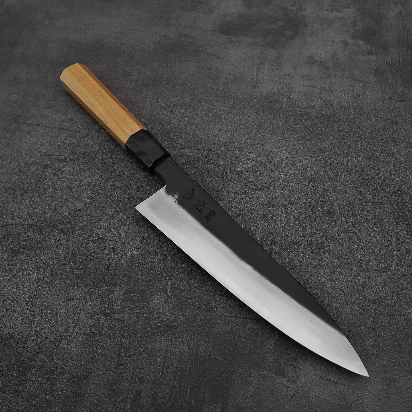 Angled view of Hatsukokoro Yoake kurouchi aogami#1 gyuto