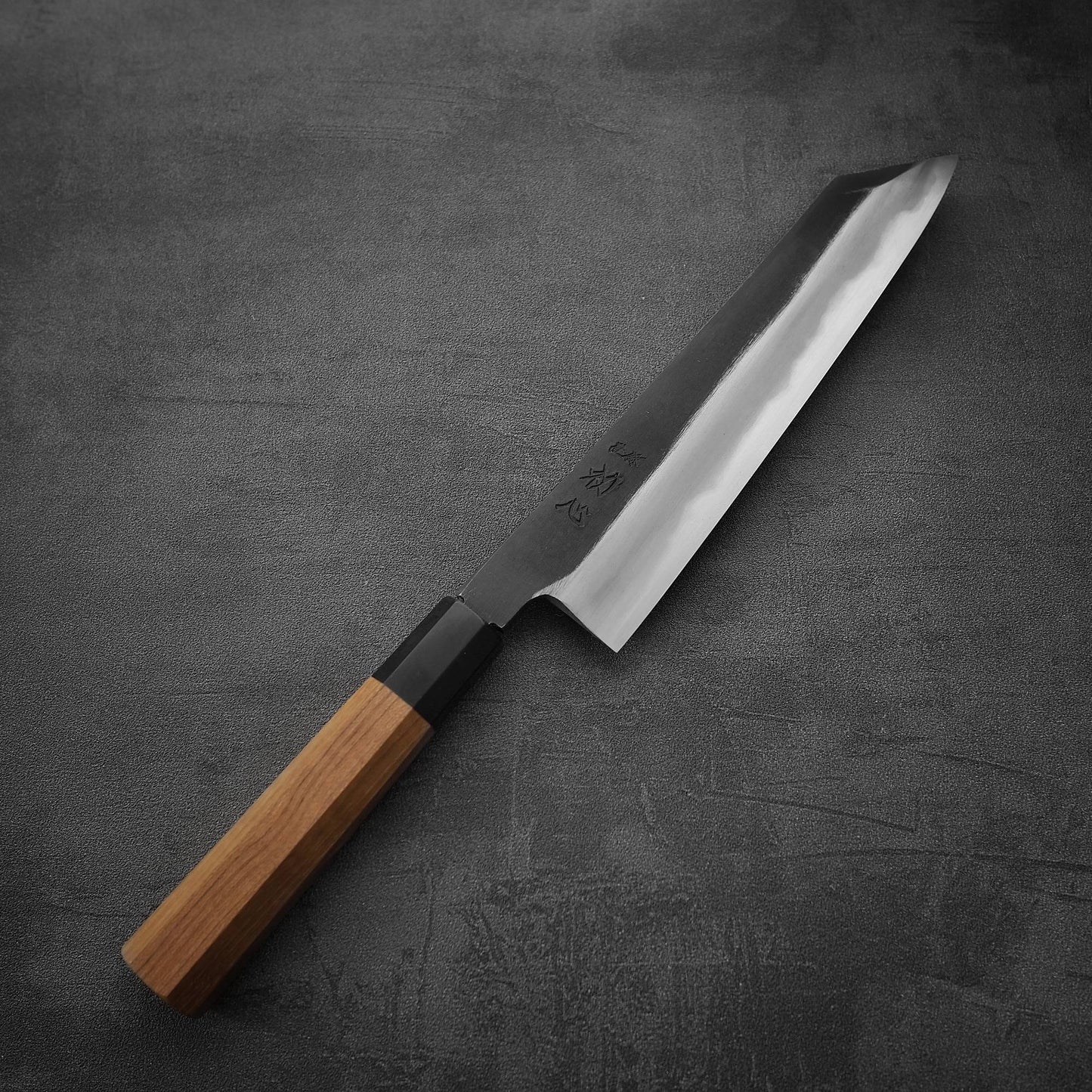 Top down view of Hatsukokoro Yoake kurouchi aogami#1 kiritsuke gyuto knife