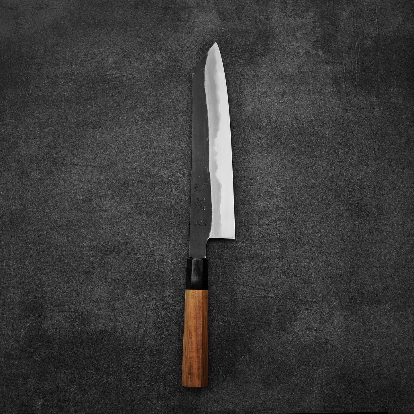 Top down view of Hatsukokoro Yoake kurouchi aogami#1 kiritsuke gyuto knife