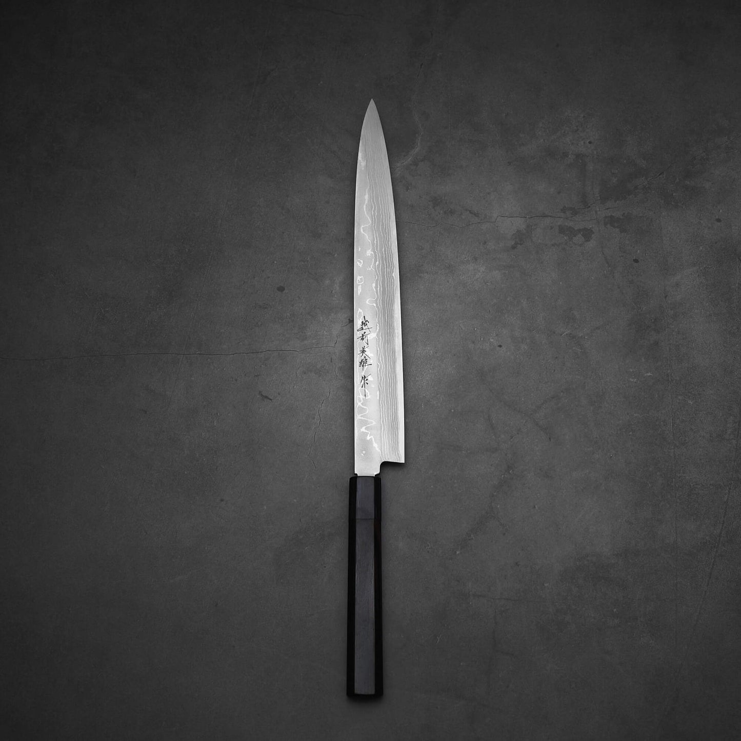 Top view of Hideo Kitaoka damascus shirogami#2 yanagiba 270mm in vertical position