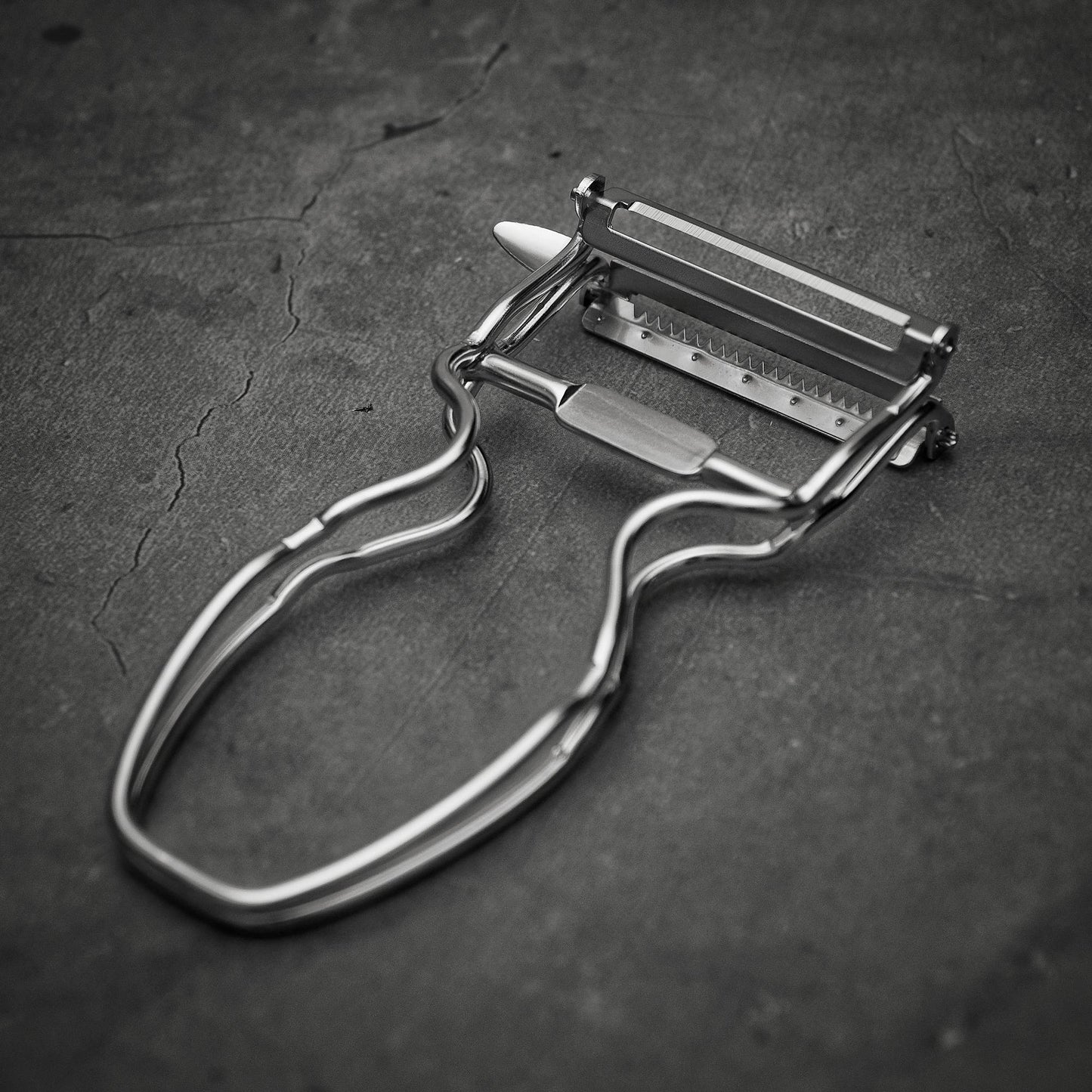 Top down view of Kankuma Tsuma and Peeler: A versatile Japanese kitchen tool for peeling and creating tsuma cuts. Made in Japan.