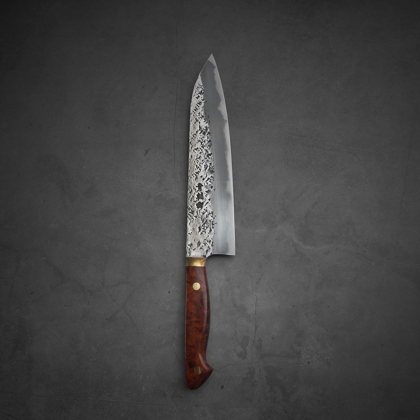 Top view of 240mm Kisuke Manaka tsuchime honwarikomi shirogami#2 gyuto knife in vertical position