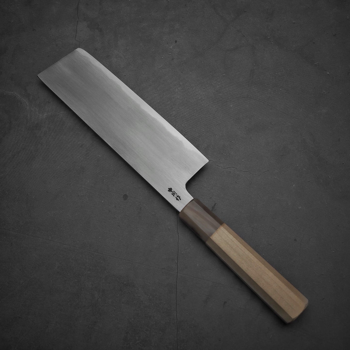 Top view of Nakagawa aogami#2 nakiri knife where tip area is facing towards upper left