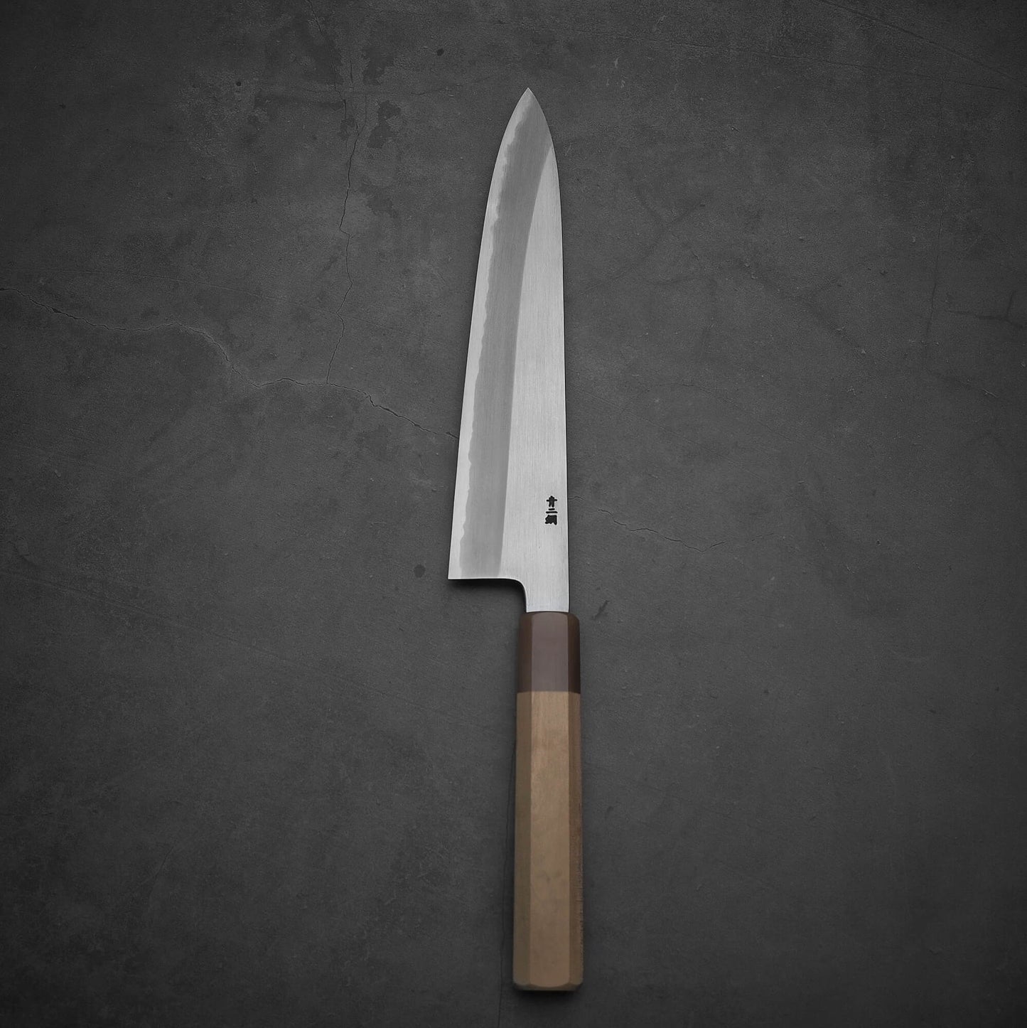 Top view of Nakagawa shinogi aogami#2 gyuto knife in vertical position. Image shows the left side.