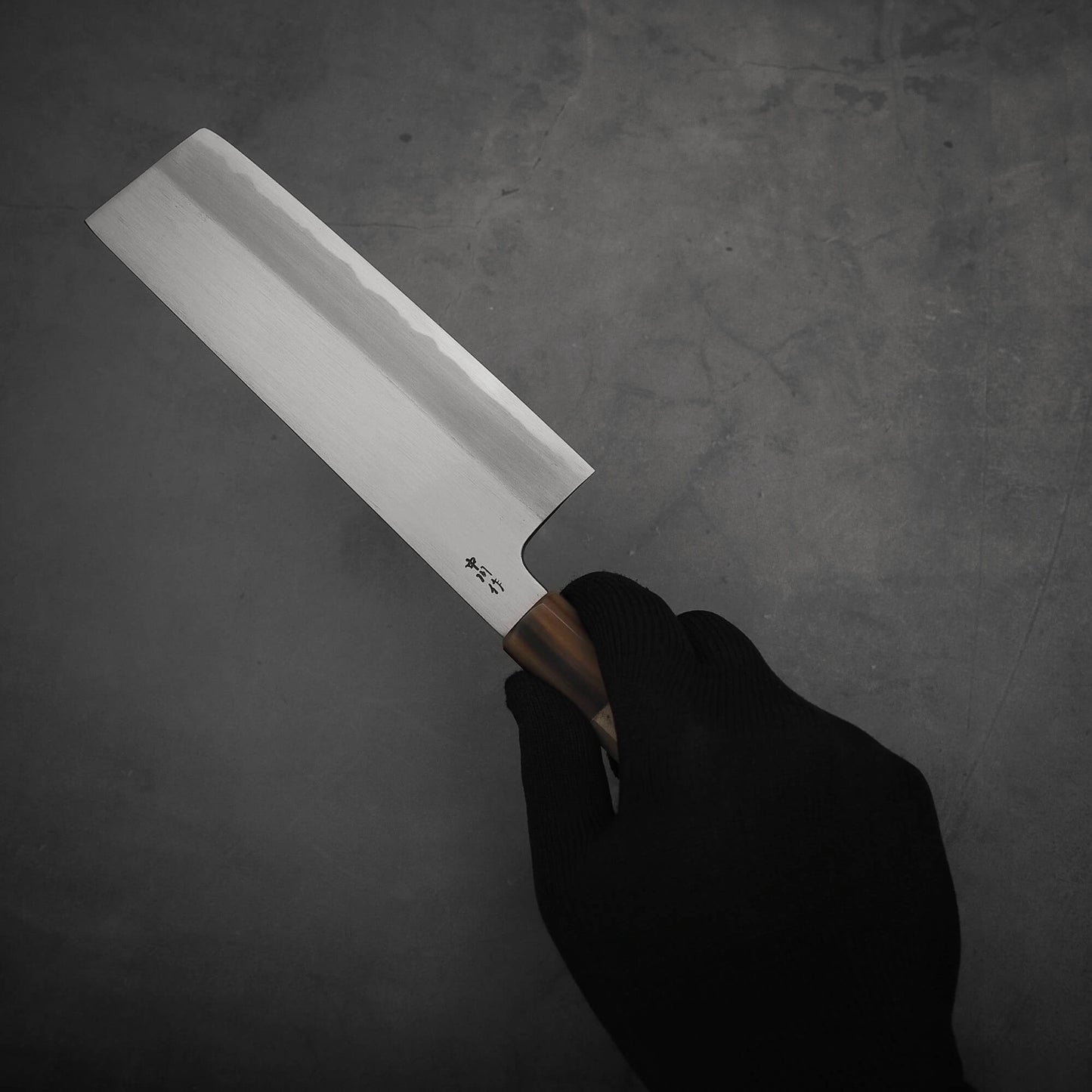 Right hand holding Nakagawa shinogi aogami#2 nakiri knife