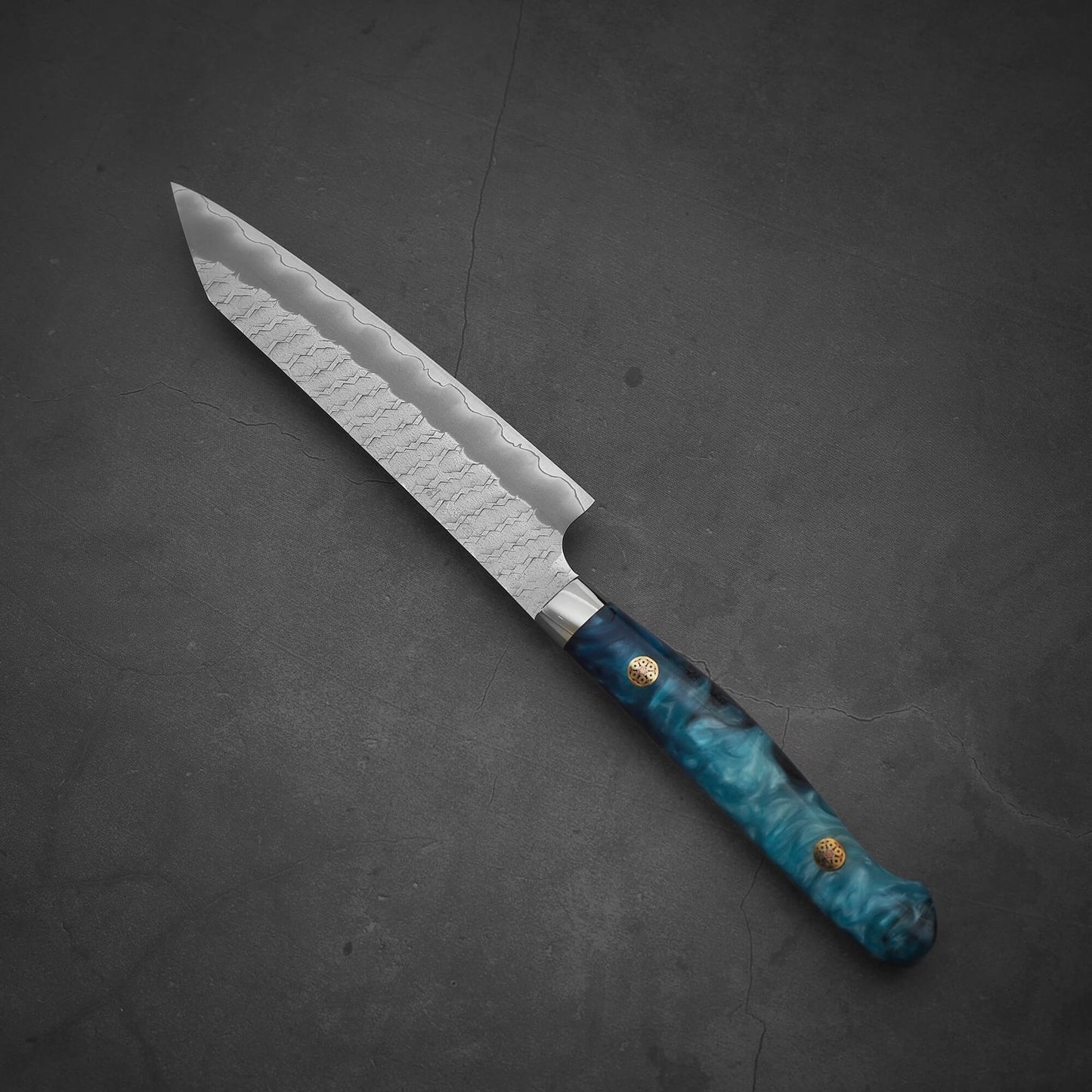 Top view of Nigara tsuchime SG2 kiritsuke petty knife 150mm in a diagonal position with the tip facing upper left