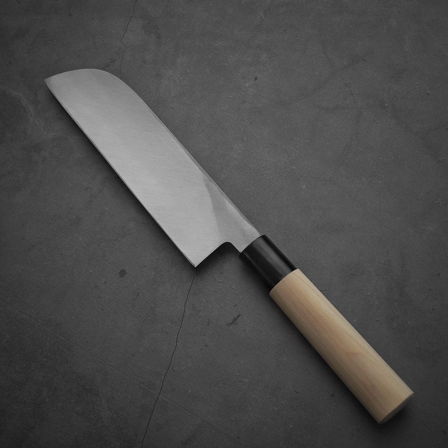 Top view of Sakai Takayuki shirogami#3 kamagata usuba knife where the pointed tip is facing towards the upper left