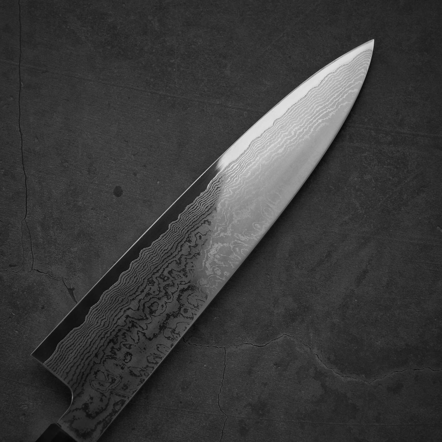 Top view of the left-blade side of Sukenari damascus XEOS gyuto