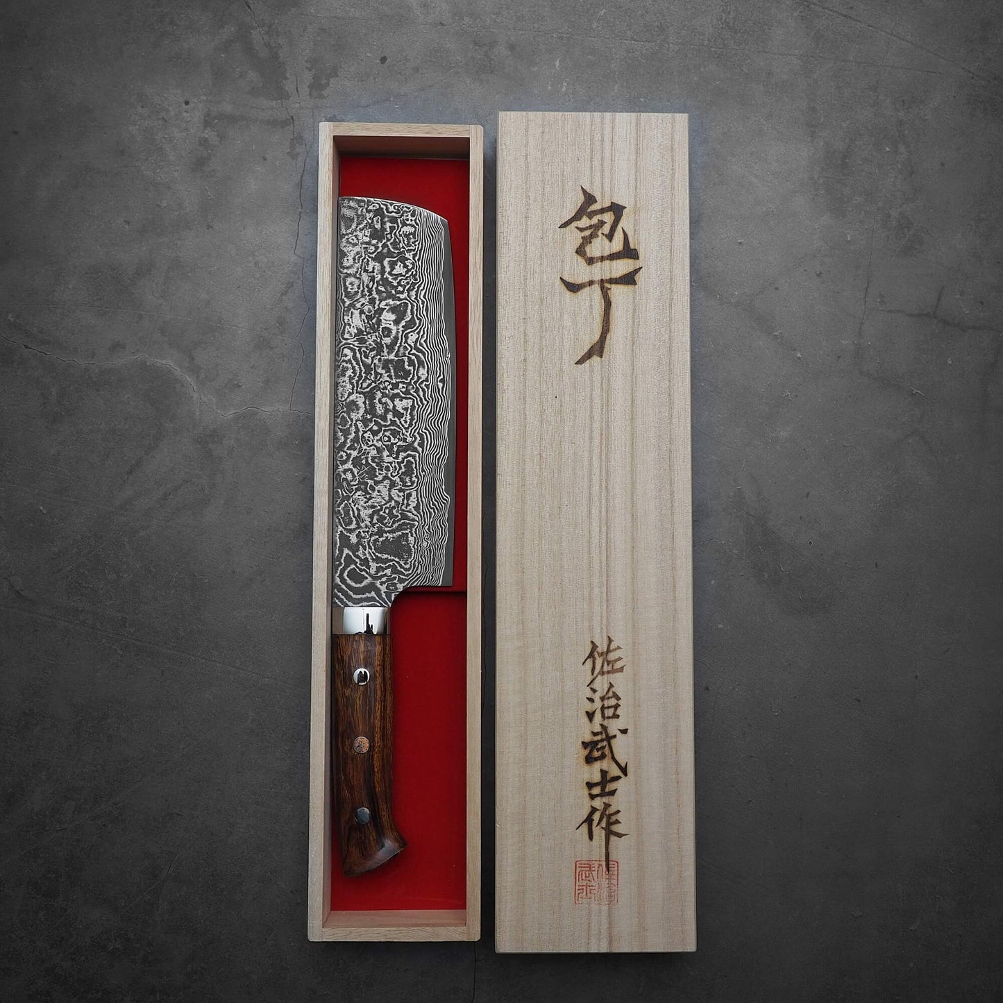 Top view of Takeshi Saji black damascus SG2 nakiri ironwood with kiri box