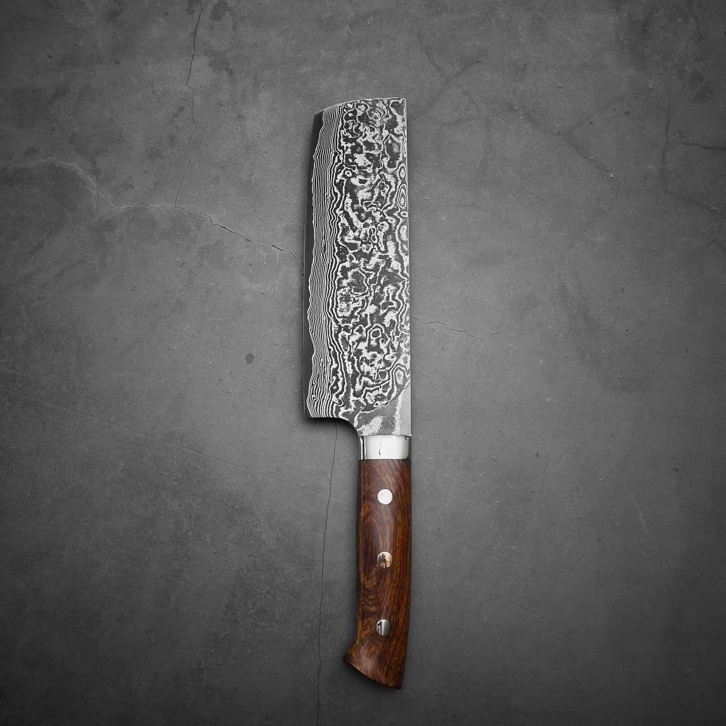 Top view of Takeshi Saji black damascus SG2 nakiri ironwood. Image shows the left side of the knife