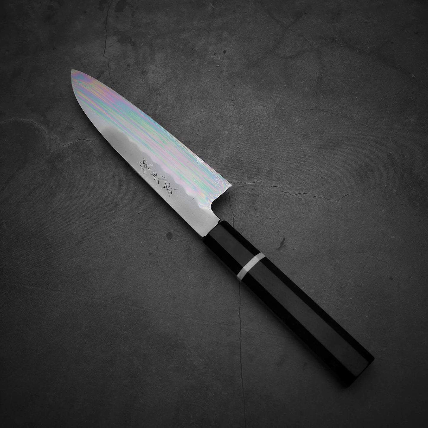 Top view of Yoshikazu Ikeda shirogami#3 santoku 165mm where the tip faces the upper left