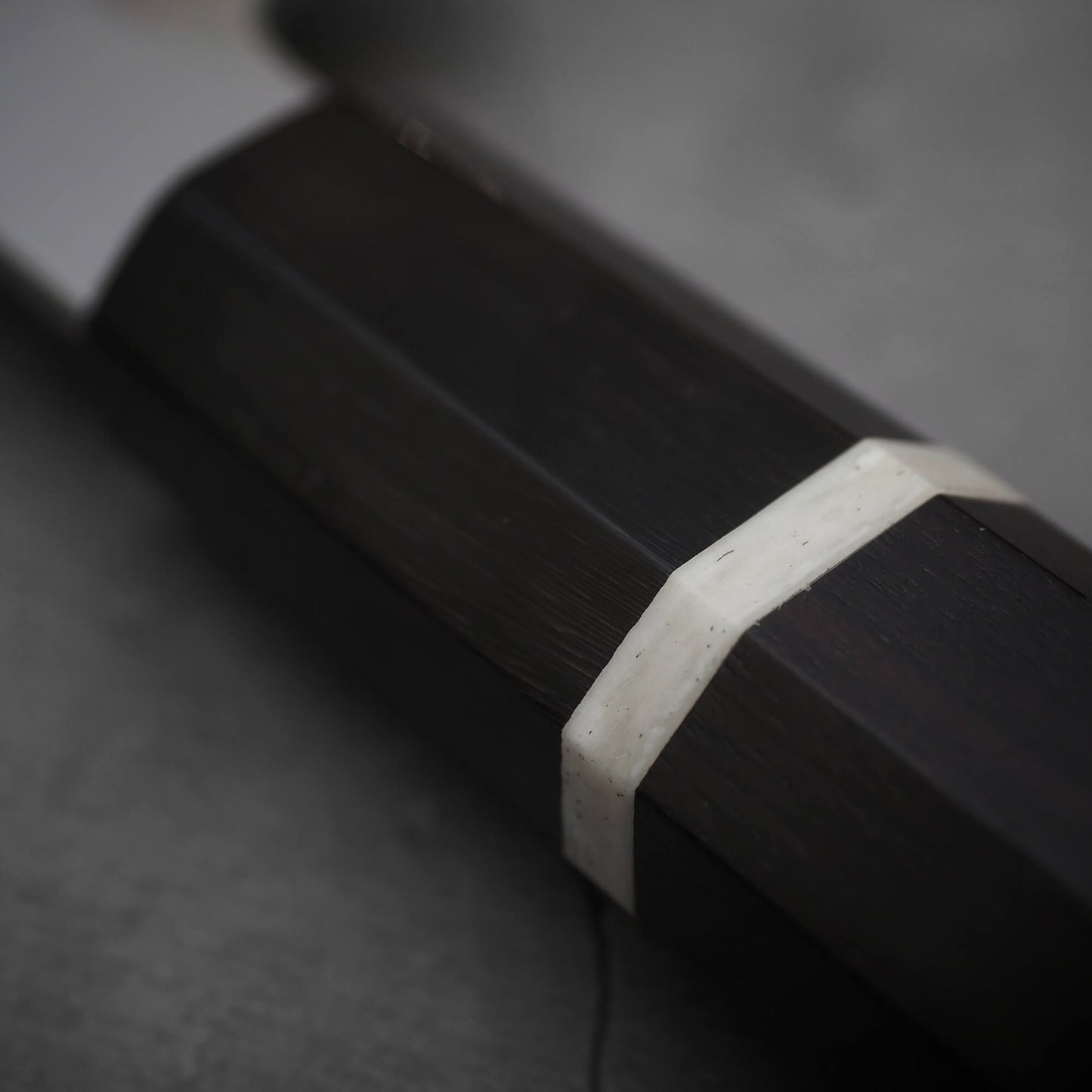 Close up view of the horn ferrule of Yoshikazu Ikeda shirogami#3 santoku 165mm