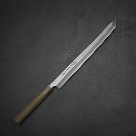 Top down view of Yoshikazu Tanaka 300mm sakimaru takohiki knife with a hand-forged blade made of shirogami#2 steel.
