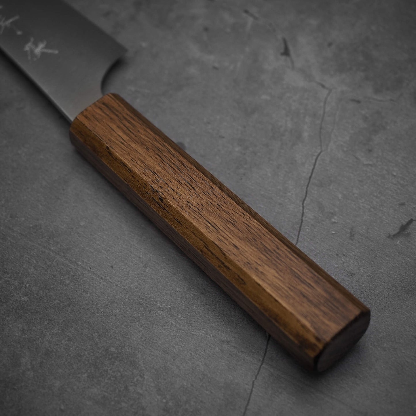 Close up view of the handle of a Yu Kurosaki HAP40 Gekko petty knife.