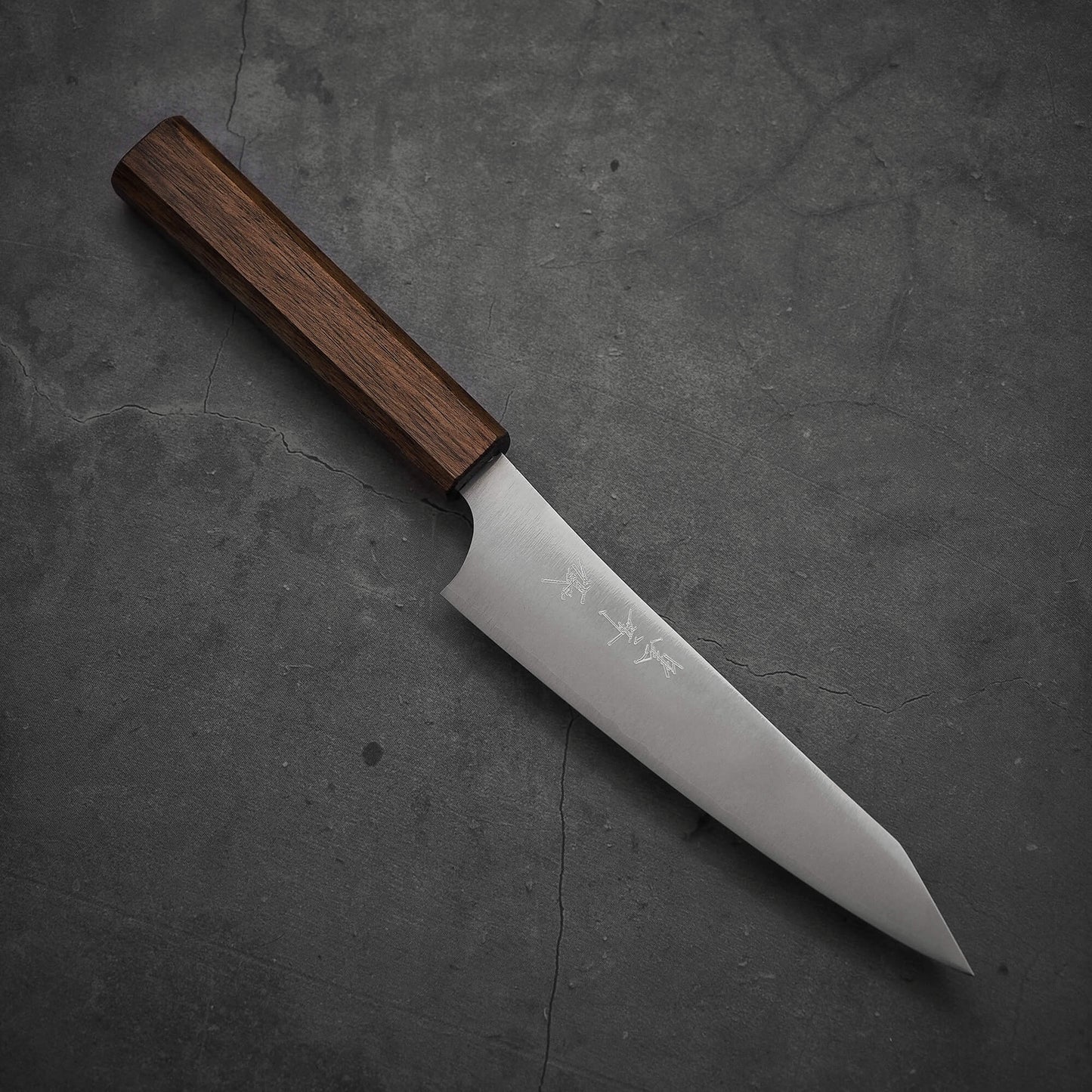 Top view of a Yu Kurosaki HAP40 Gekko petty knife. The pointed tip is facing towards the lower right.