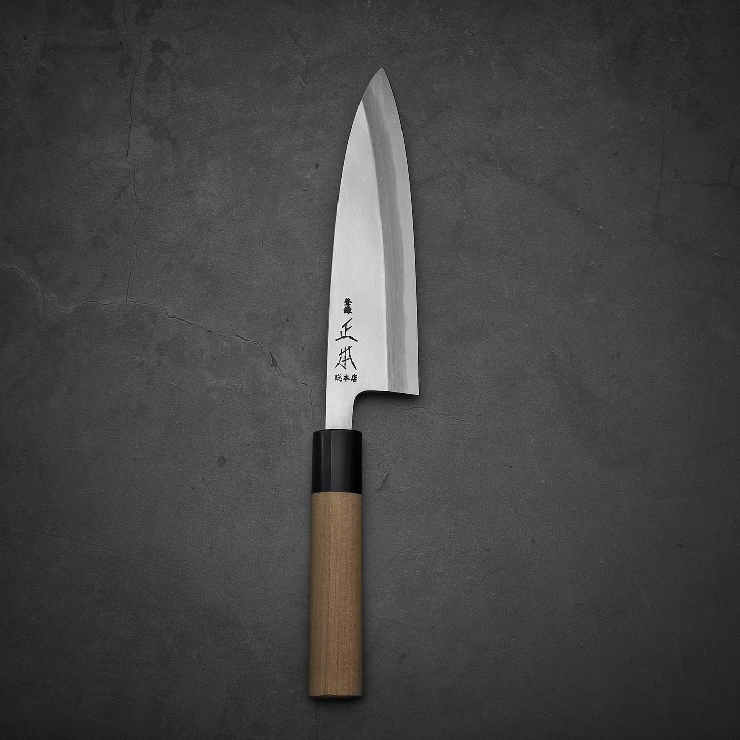 Top view of Masamoto KS shirogami#2 ai-deba knife in vertical position