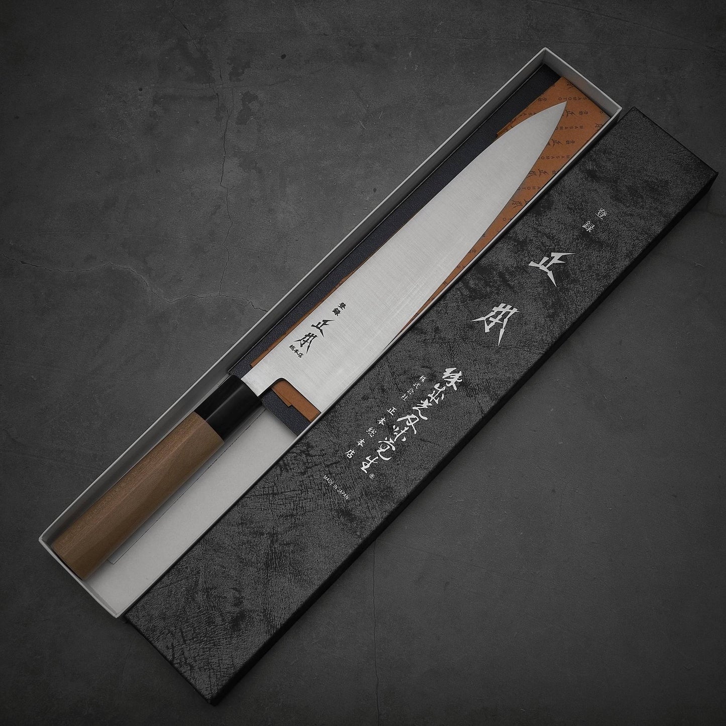 Top view of Masamoto KS shirogami#2 gyuto inside its box