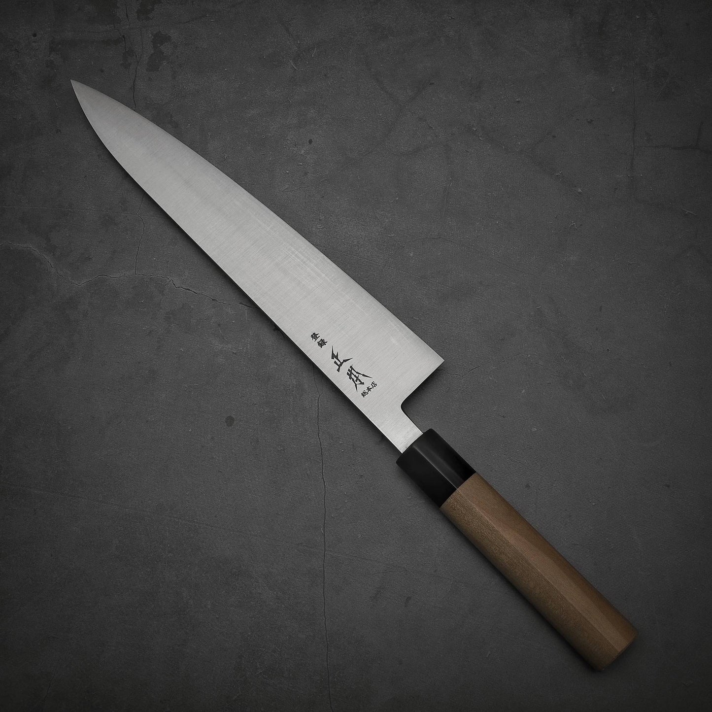 Top view of Masamoto KS shirogami#2 gyuto. Pointed tip is facing towards upper left