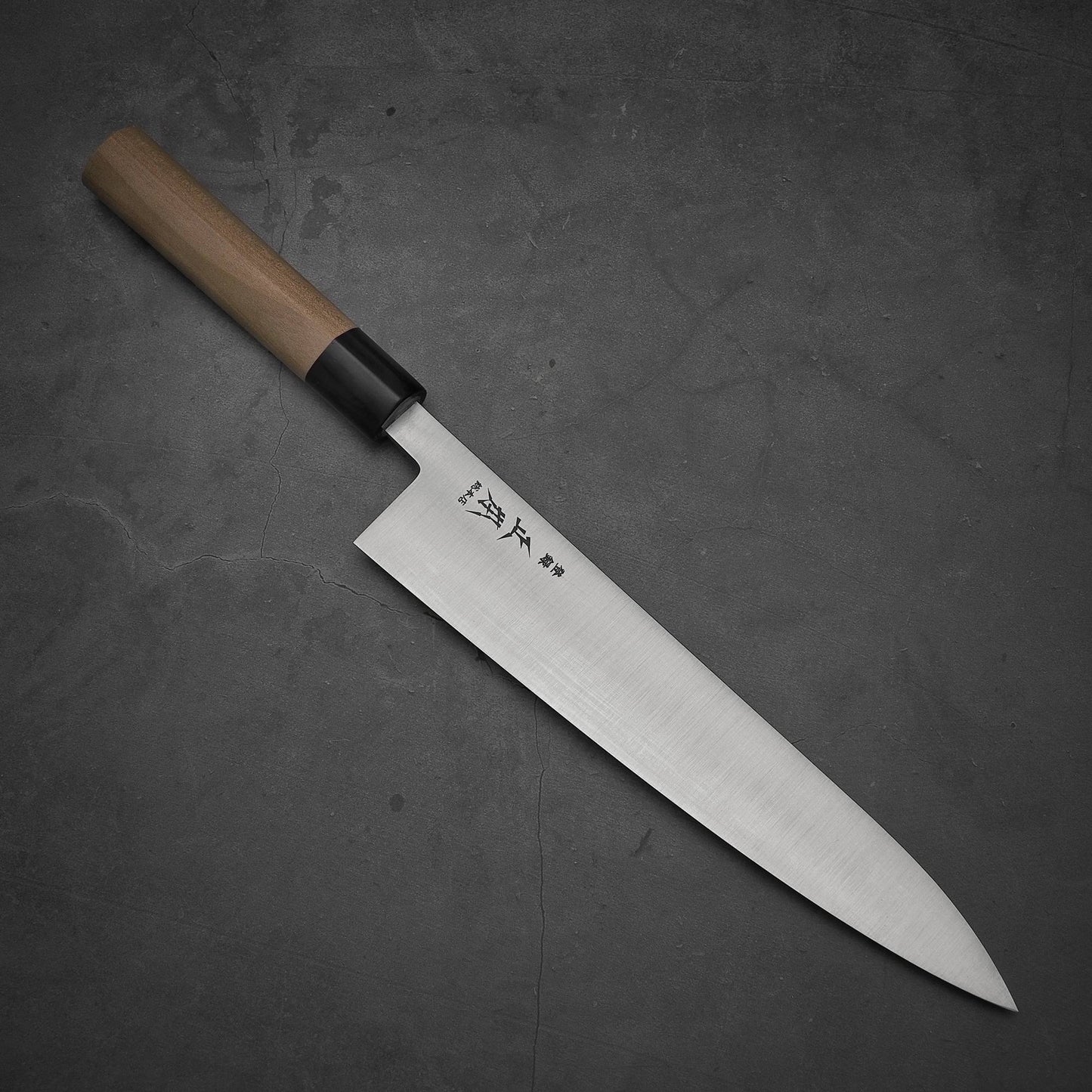 Top view of Masamoto KS shirogami#2 gyuto. Pointed tip is facing towards the lower right