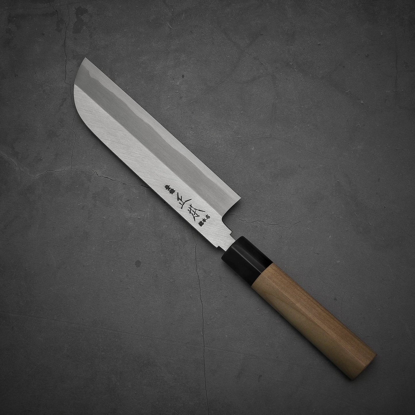 Top view of Masamoto KS shirogami#2 kamagata usuba knife where pointed top is facing towards upper left