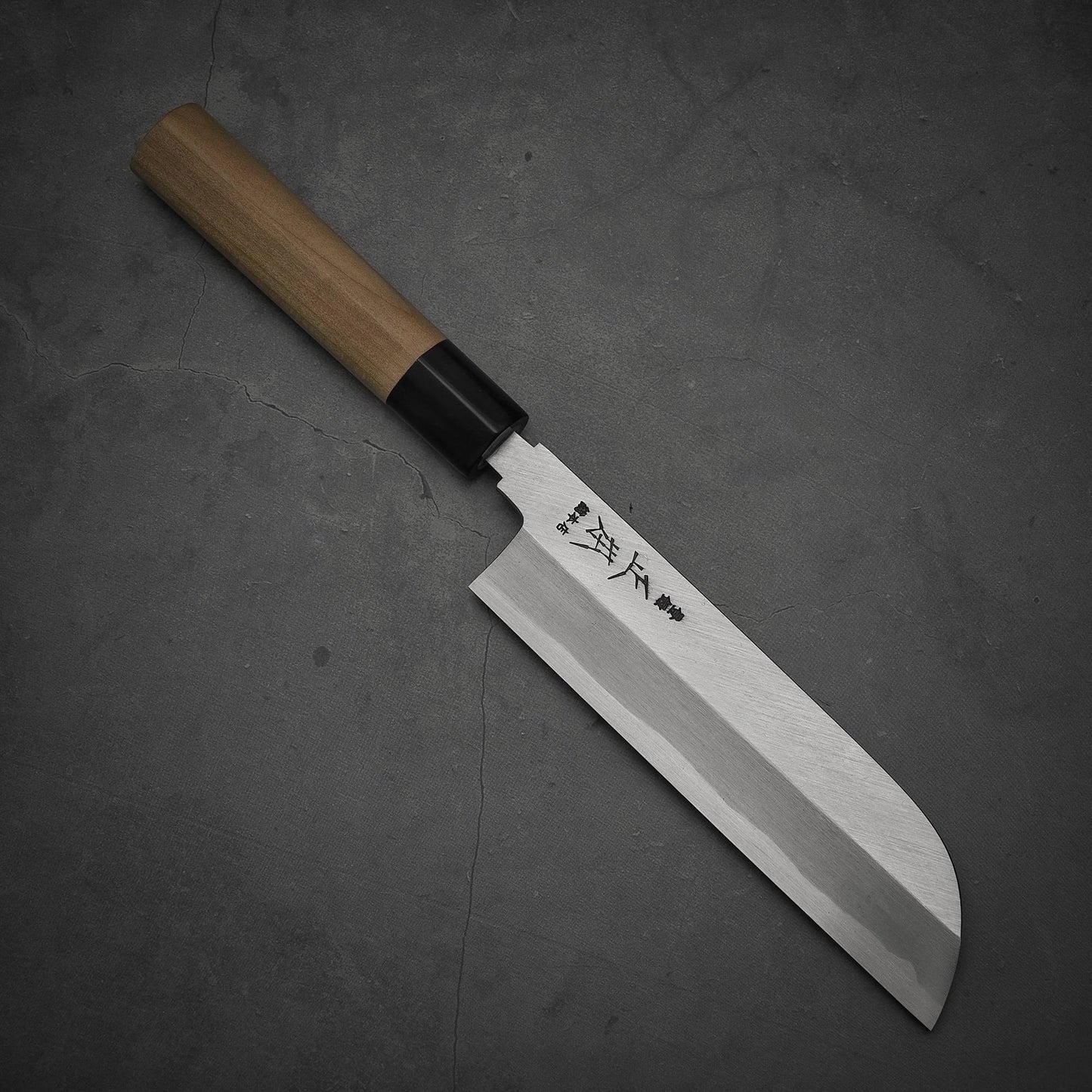 Top view of Masamoto KS shirogami#2 kamagata usuba knife where pointed tip is facing towards lower right
