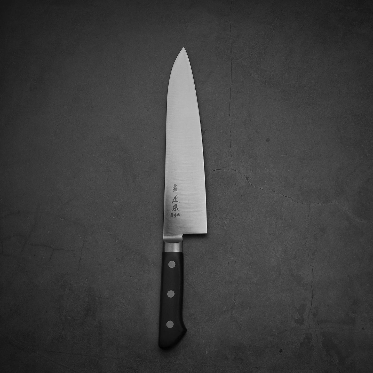 Top view of Masamoto VG yo-gyuto knife in vertical position