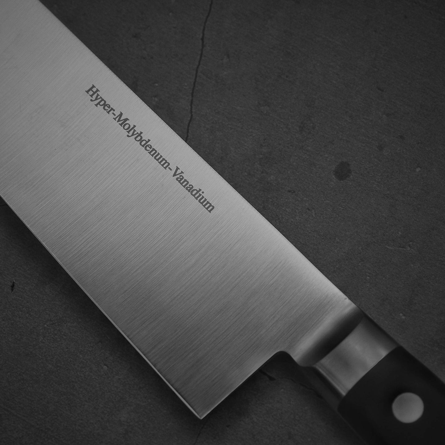 Close up view of the steel name of Masamoto VG yo-gyuto knife