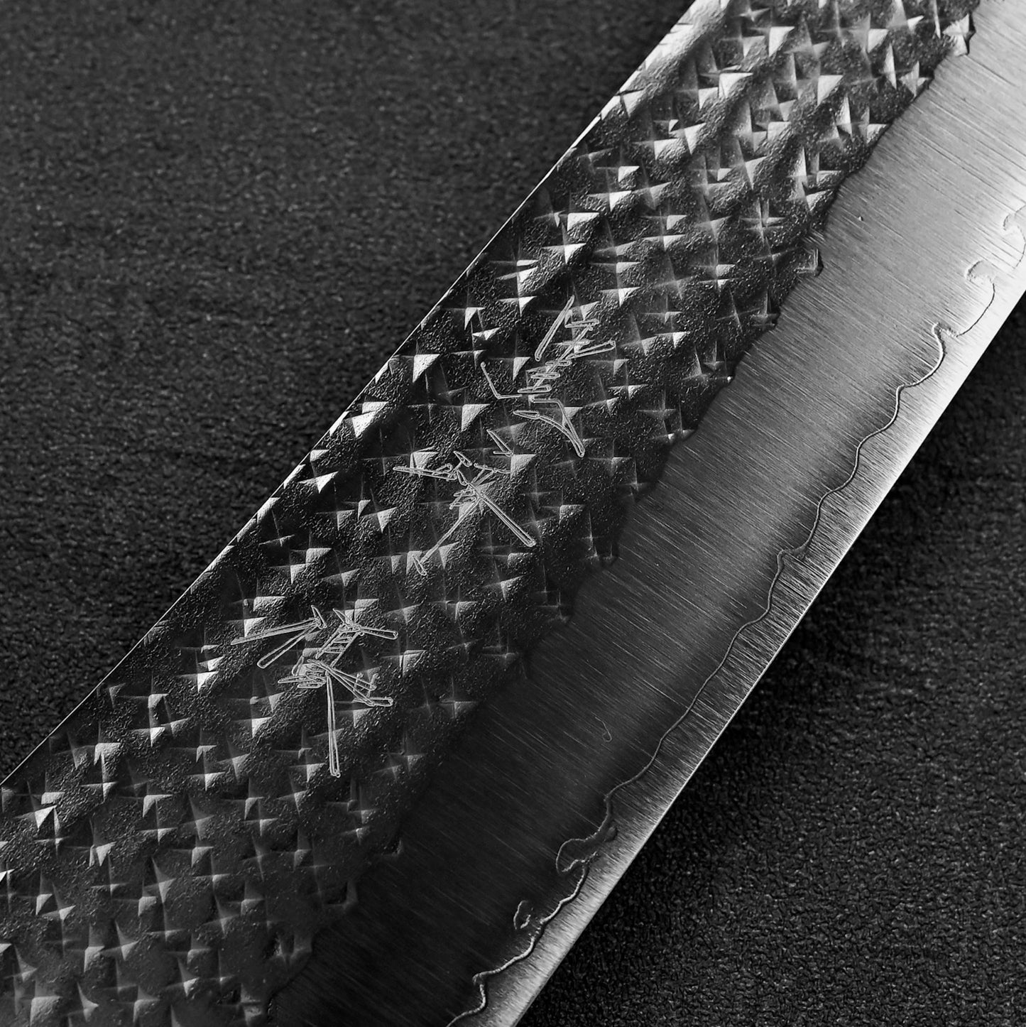 Close up of the kanji of Yu Kurosaki Senko SG2 gyuto knife
