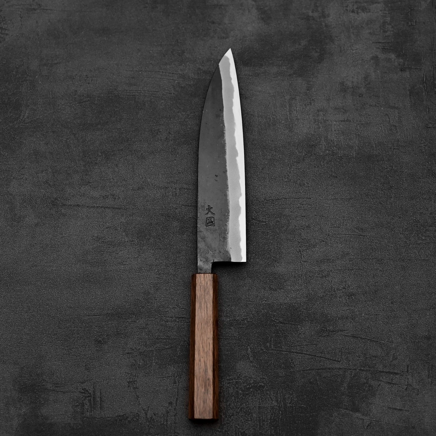 Top down view of Hinokuni kurouchi shirogami#1 gyuto knife in vertical position