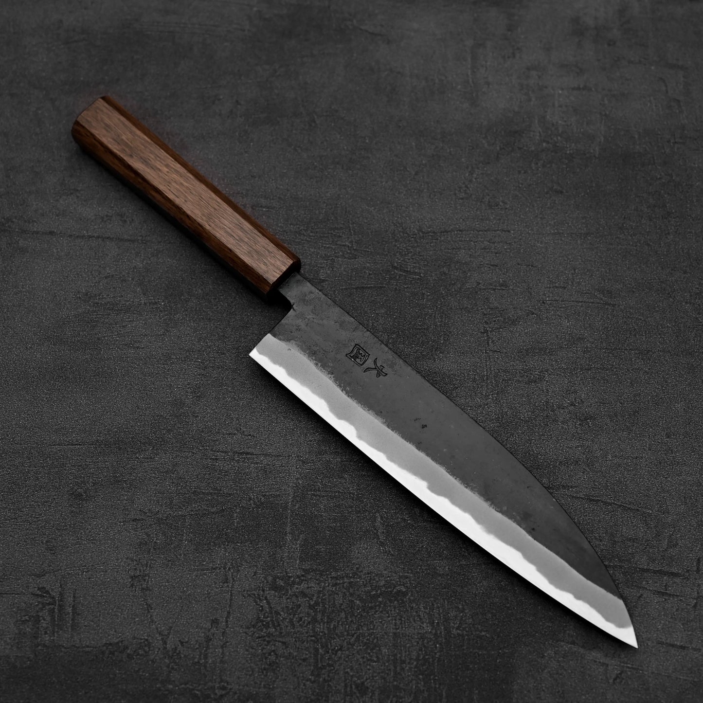Another top down view of Hinokuni kurouchi shirogami#1 gyuto knife in diagonal position