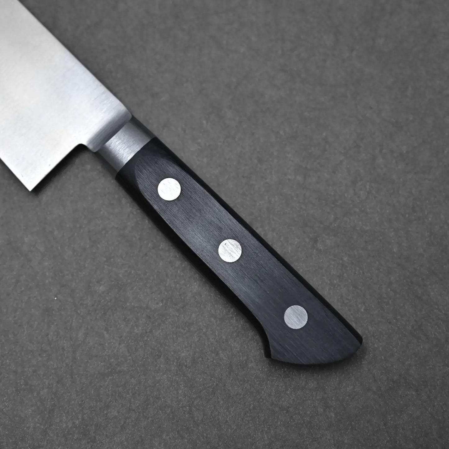 Close-up shot of the handle of the 210mm Masahiro gyuto