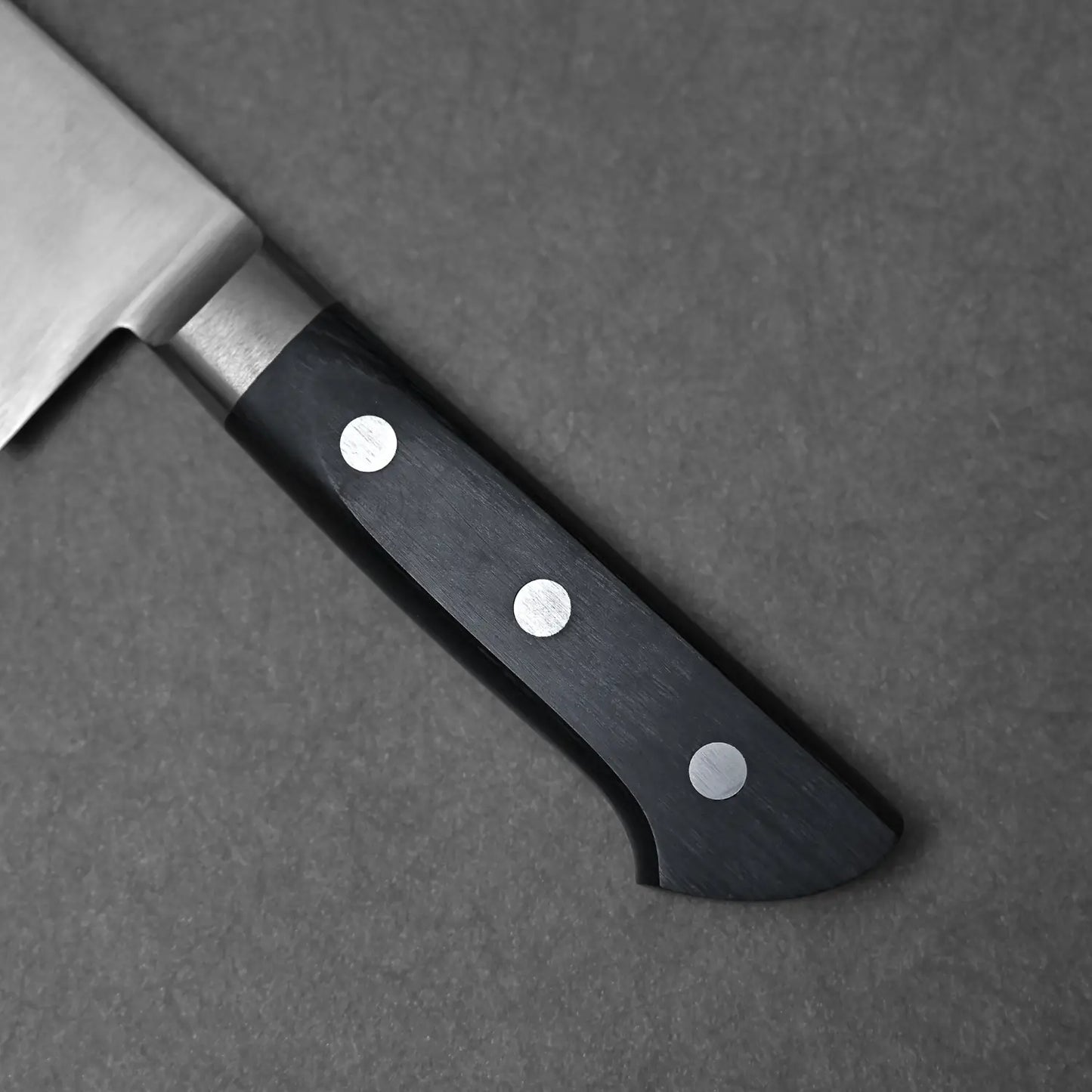 Close-up shot of the handle of the 240mm carbon steel gyuto from Masahiro