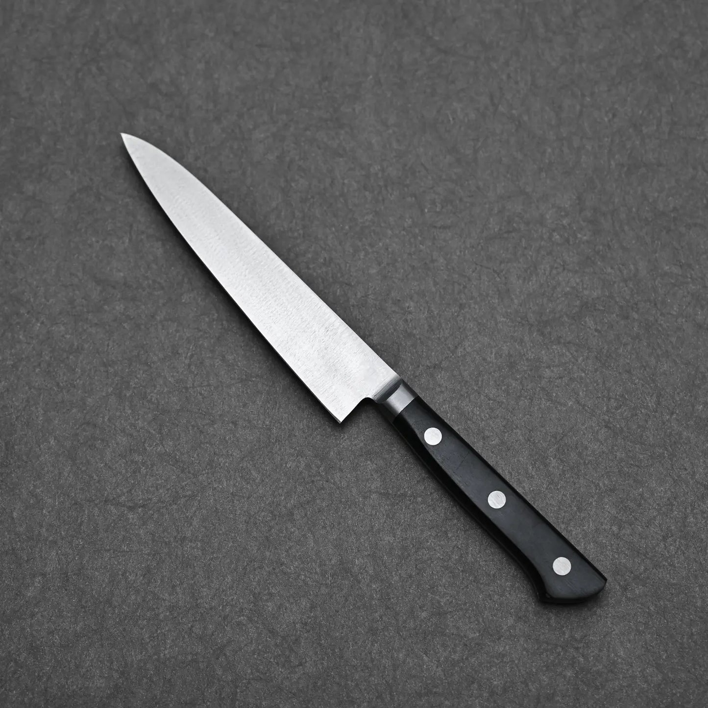 Angled view of the Masahiro petty showing the back side