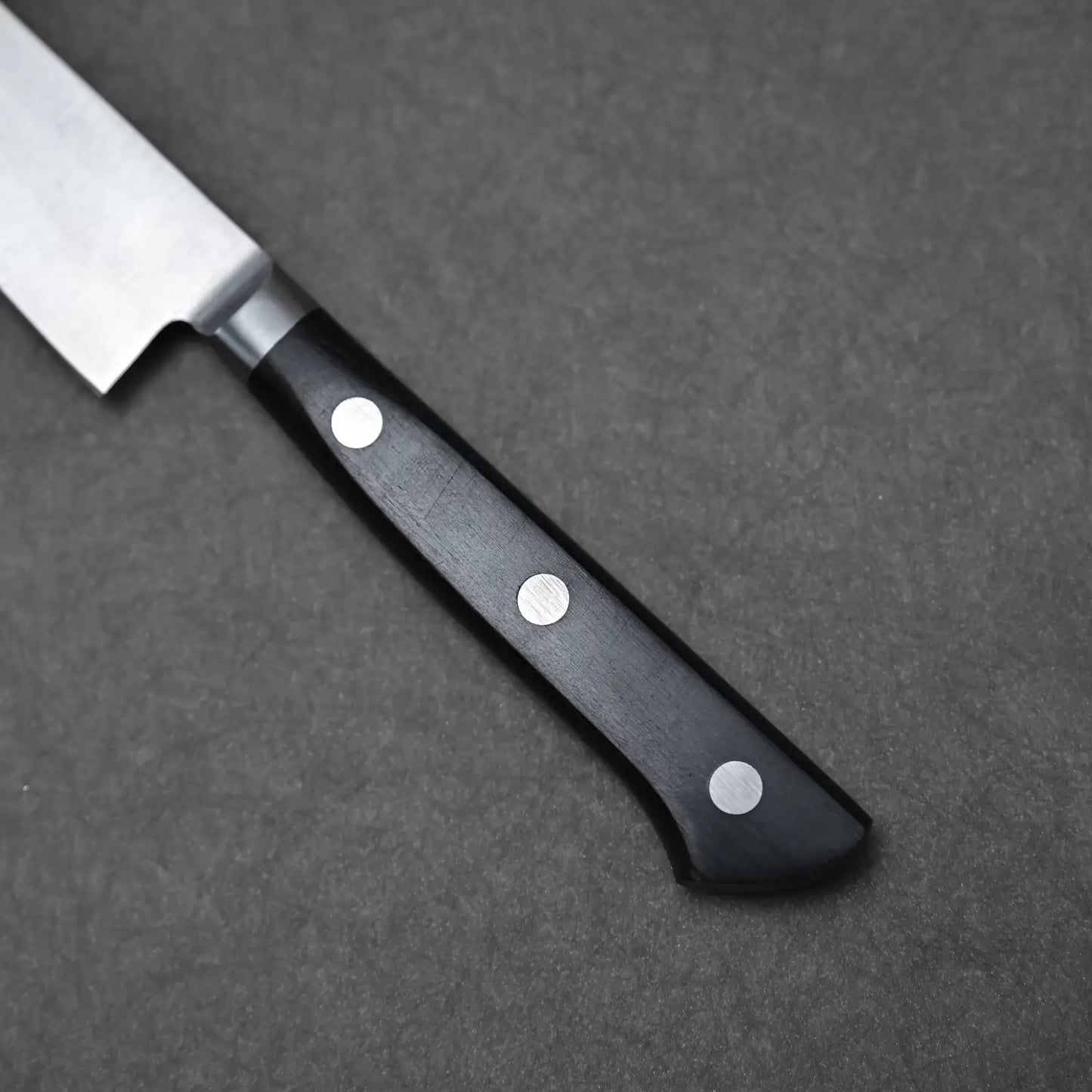 Close-up shot of the handle of Masahiro petty