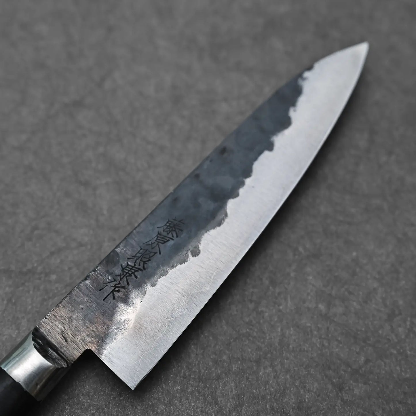Close-up view of the front blade of the 120mm denka petty