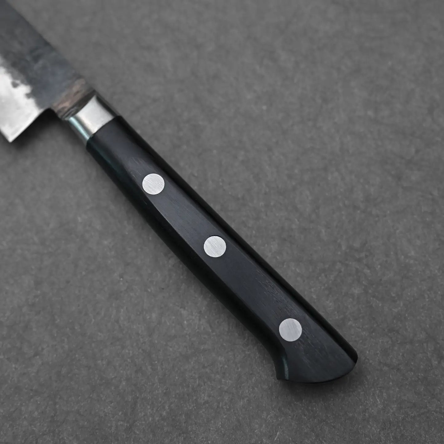 Close-up view of the handle of 120mm denka petty