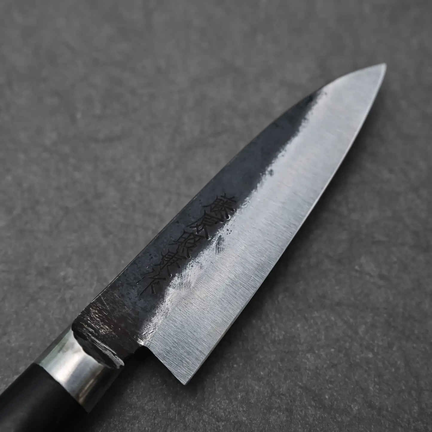 Close-up of denka petty knife showing maker's mark