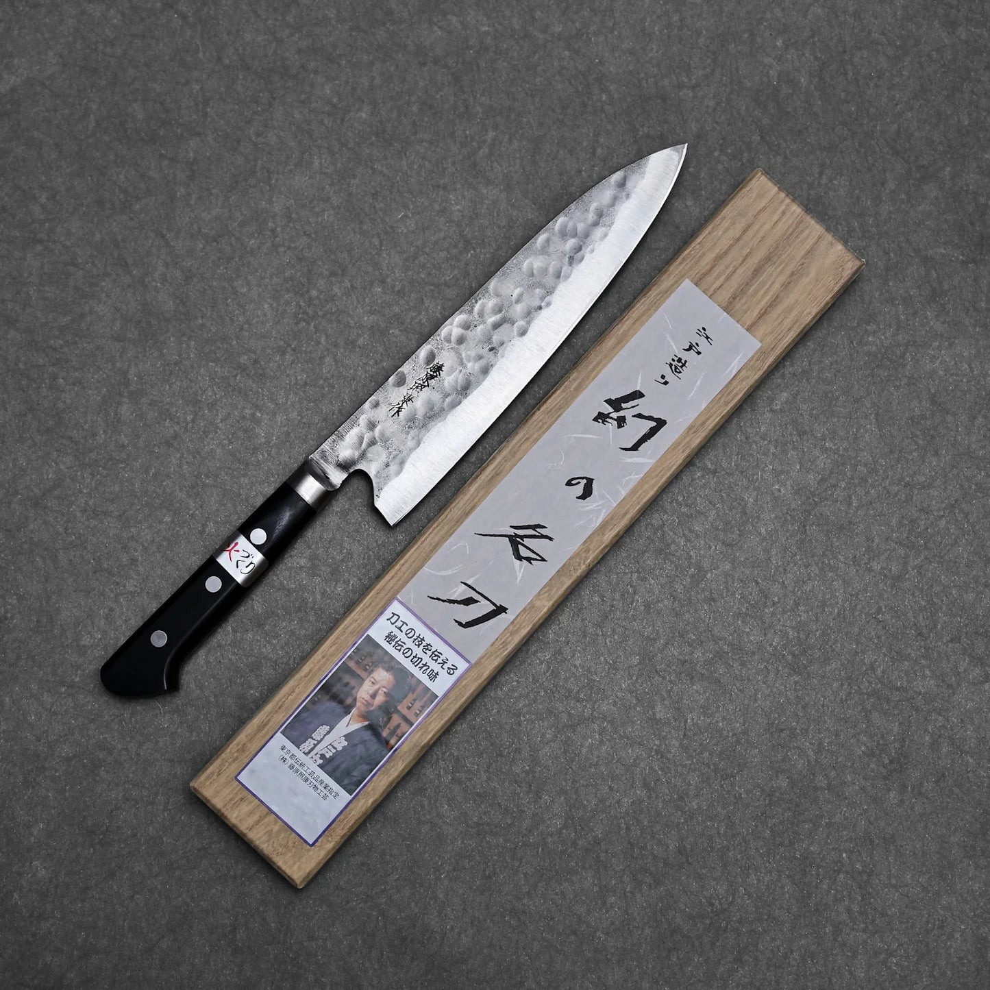 Complete blade profile of the gyuto with its box beside it
